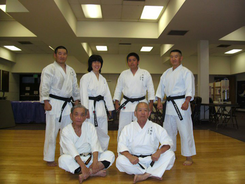 Guest instructor Rei Fujikawa Sensei (seated, left) of Shotokan karate, a former team member of Hidetaka Nishiyama's legendary 1970s kumite team, assists Art Ishii (seated, right) in running a black belt workshop at Art's dojo in 2012. Standing, from left to right, are dojo members Randal Kumagai, Cynthia Nishinaka, Walter Nishinaka, and Russell Kumagai. Photo courtesy of Matsubayashi Shorin-ryu Dojo of Little Tokyo.